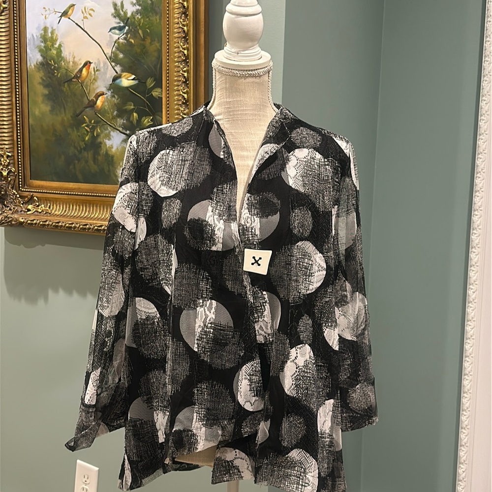 Black and White asymmetrical jacket IC by Connie k. Size is XL.